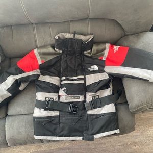 The north face sleep tech coat has hood in hidden compartment